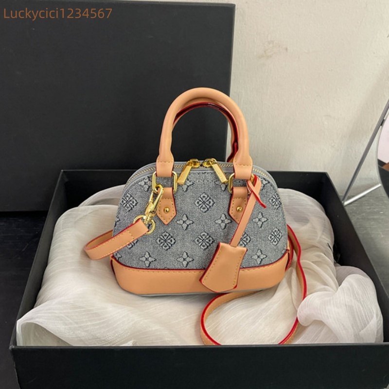 Luxury Bag Designer Bag Fashionable female Advanced printed retro light hand-held vintage flower shell new versatile and temperament crossbody bag sho