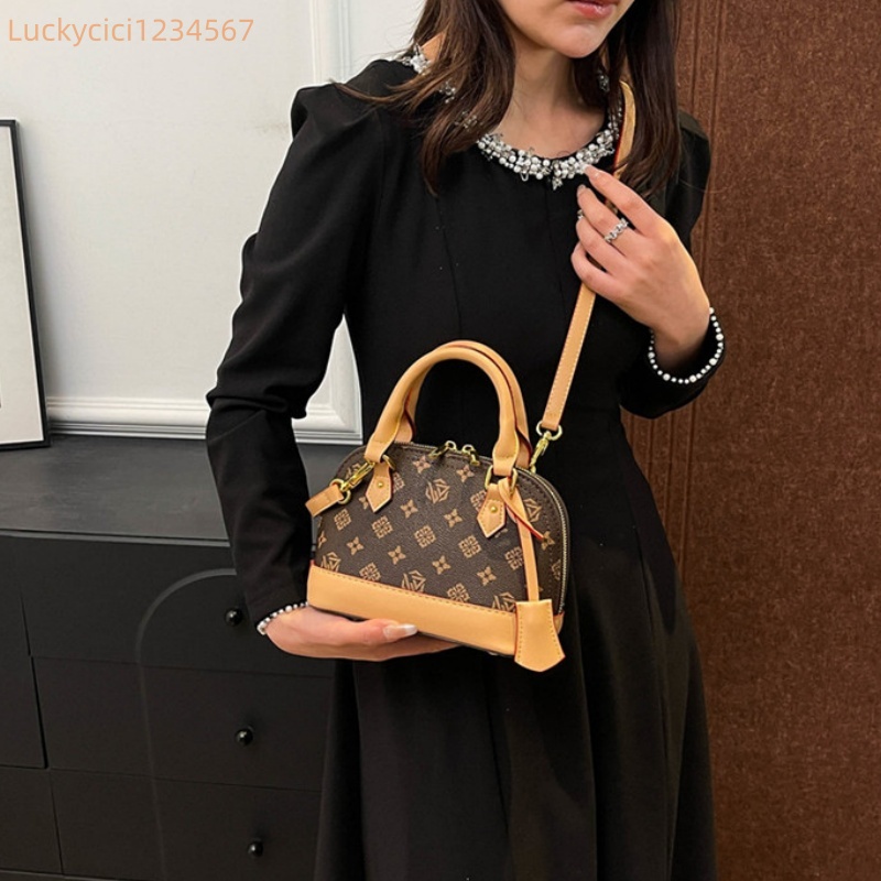 Luxury Bag Designer Bag Fashionable female Advanced printed retro light hand-held vintage flower shell new versatile and temperament crossbody bag sho