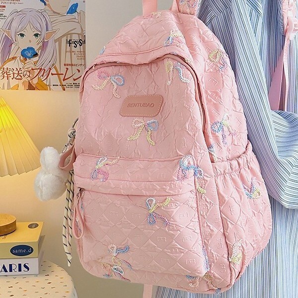 The new designer backpack cartoon backpack is very suitable for middle school girls as a multifunctional large capacity backpack