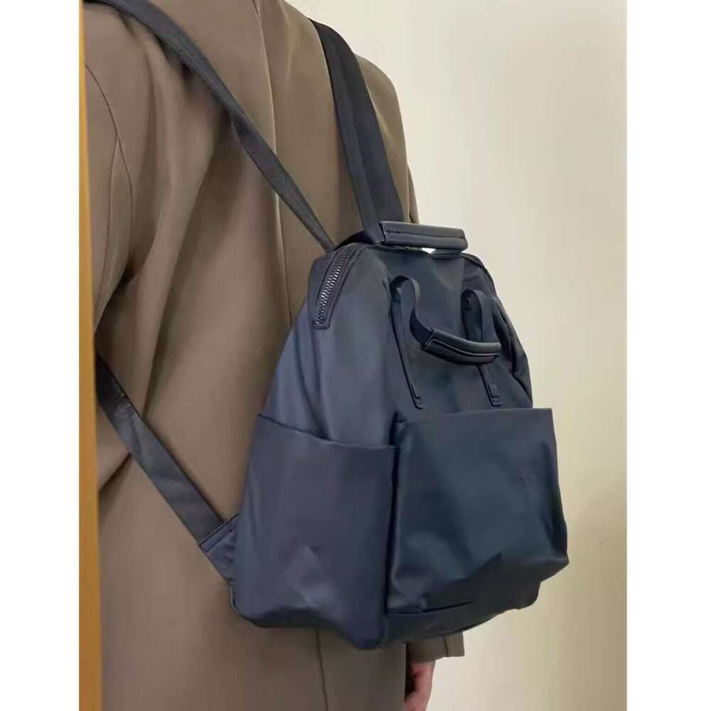 Waterproof Nylon New Trendy Travel Backpack Fashion Versatile Handheld Lightweight Commuter School Bag For Women High Quality