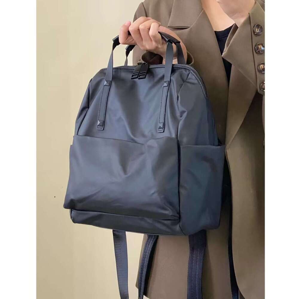 Waterproof Nylon New Trendy Travel Backpack Fashion Versatile Handheld Lightweight Commuter School Bag For Women High Quality