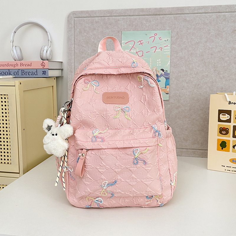 The new designer backpack cartoon backpack is very suitable for middle school girls as a multifunctional large capacity backpack