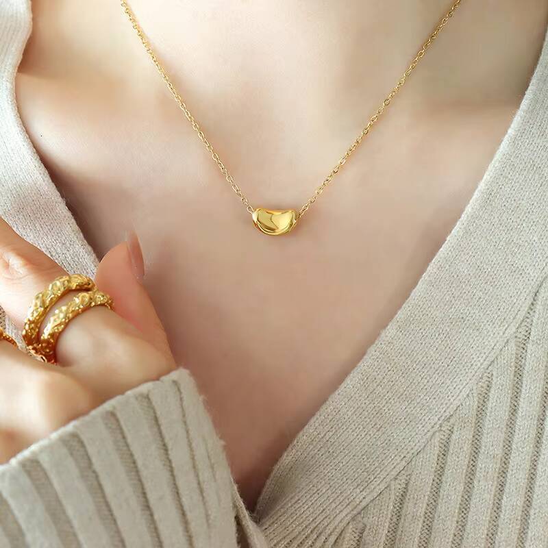 Hot Selling Womens Stainless Steel 18K Gold Plated Necklace Fashion Jewelry Chain with Lucky Golden Bean Pendant Zircon Stone