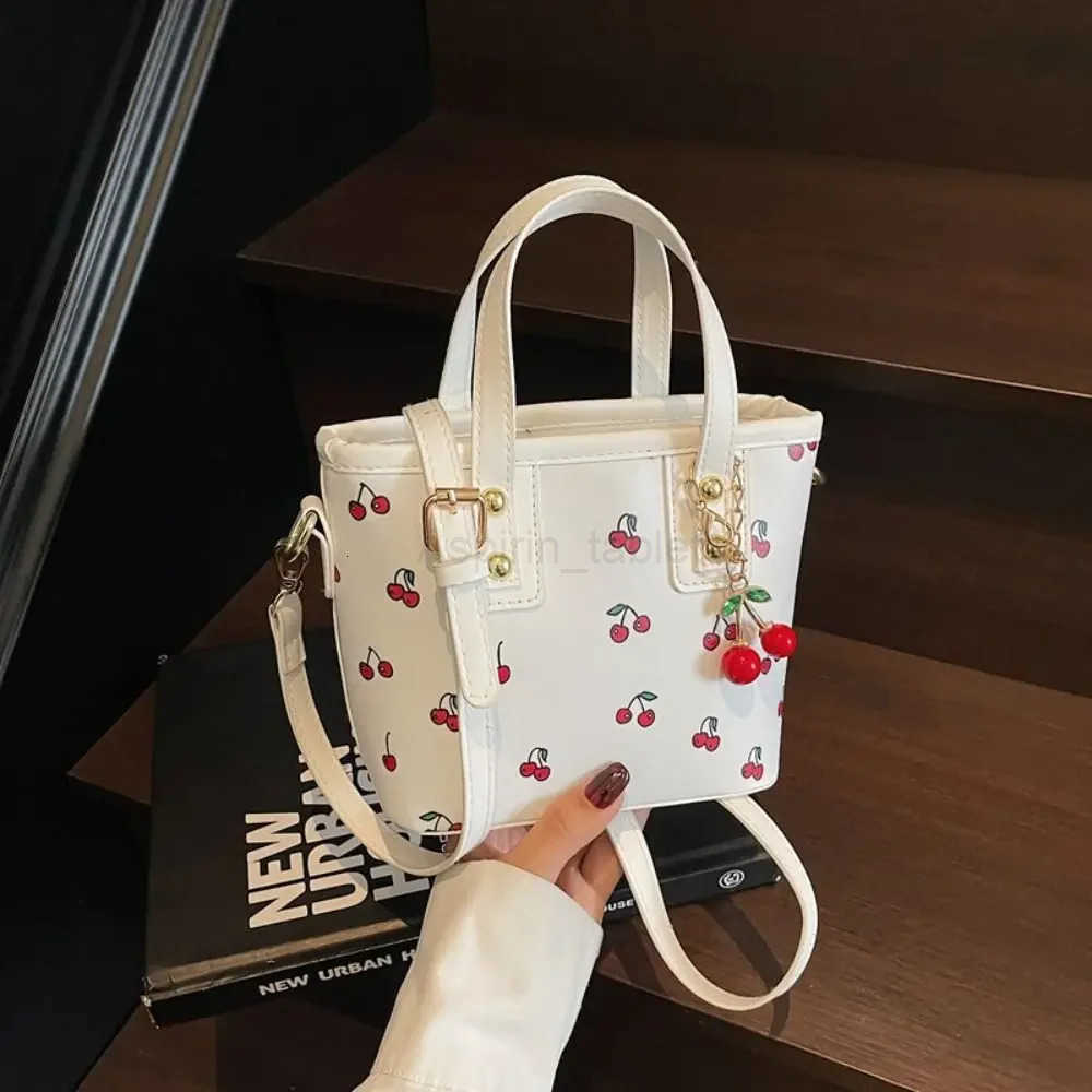 Stylish PU Leather Cherry Shoulder Bag Large Capacity Adjustable Strap Crossbody Bag Comfort with Cherry Pendant Handbag Women M251024