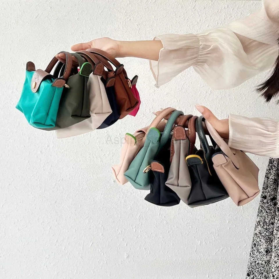 French Mini Coin Purse Mobile Phone Bag Single Shoulder Crossbody Handbag With Perforated Shoulder Strap Womens Bag M251024