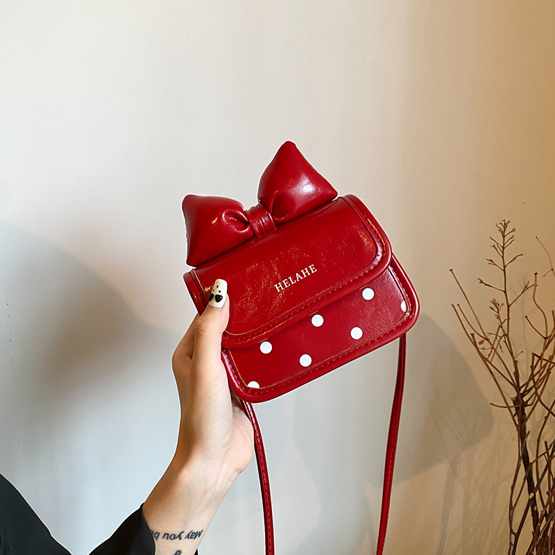 New designer children's bag bow mini square bag parent-child design girl italic coin headphone jack red envelope