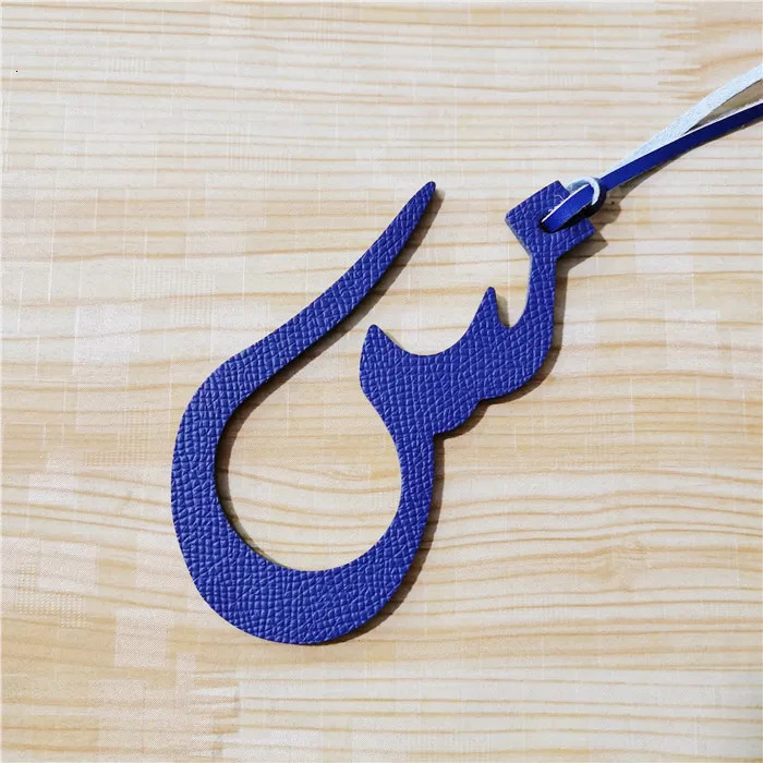 Wholesale Retail Real Natural Leather Character Alphabet Letter Keychain Backpack Pendant Ladie Bag Charm 251021
