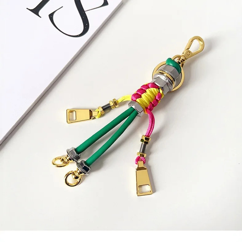 Robot Pendant Metal Rope Woven Lanyard Mens and Womens Bag Pendant Trendy Keychain Creative Car Pendant 251023