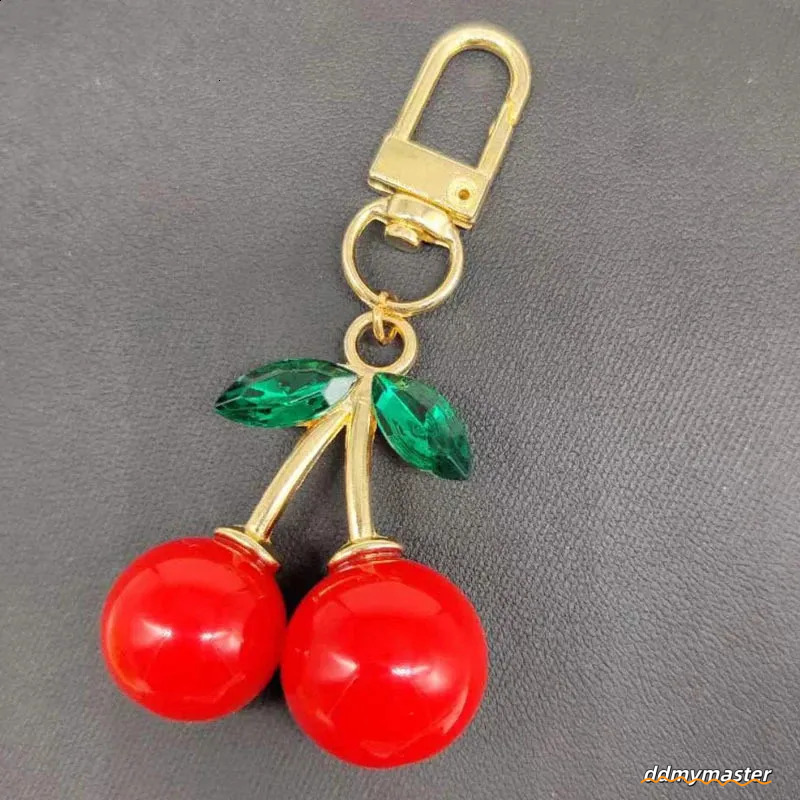 Trendy Alloy Cherry Keychain Charm Accessory Womens Bag Car Pendant Adornment Individualized Decoration For Women 240829 Ddmymaster