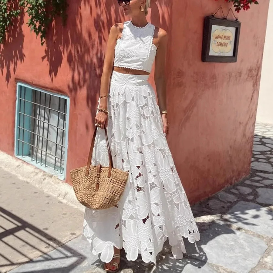 PRINTKAOIR Spring Summer Women White Flower Casual Lace Hollow Out Vest Top And Long Skirt Two Piece Set Holiday 251016
