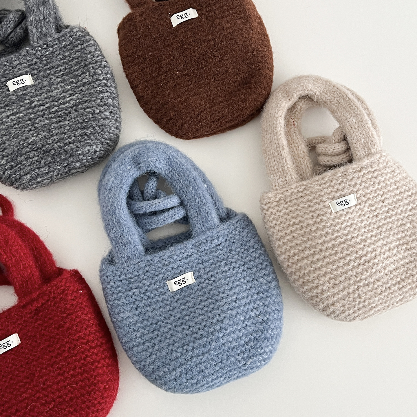 New Korean children's bag designer hand-held knitted small bag, children's candy color