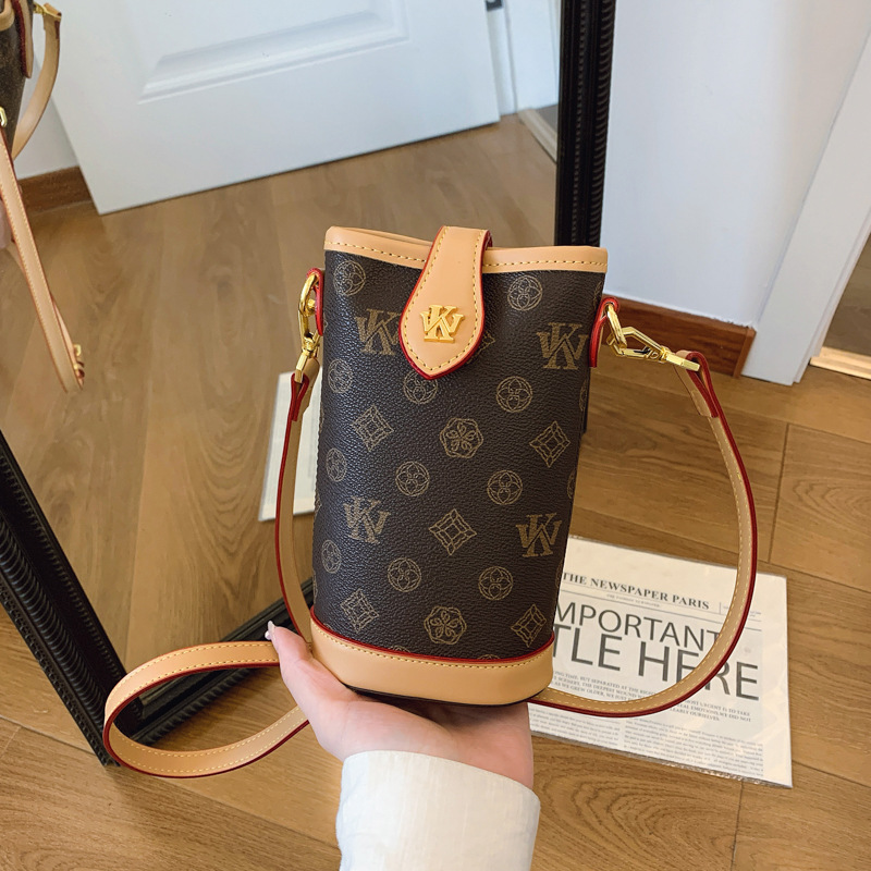 High sense fashion bucket bag female new presbycusis cylinder bag mobile phone bag all shoulder slant cross bag 2025