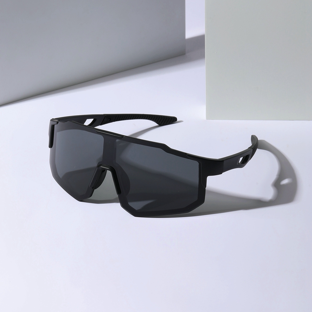 1 pair of men's mechanical-style sunglasses with futuristic, fashionable design featuring diverse shapes, mixed materials, and contrasting colors