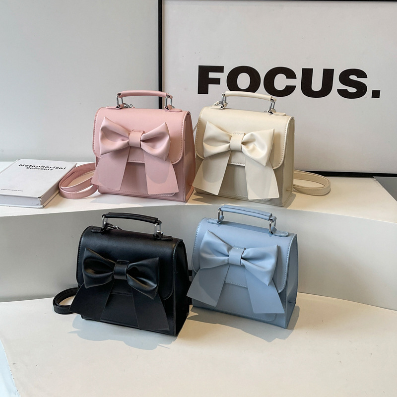 Free shipping designer bag Backpack Women New Texture Niche Design Handheld Bow School Bag Lightweight Travel Backpack