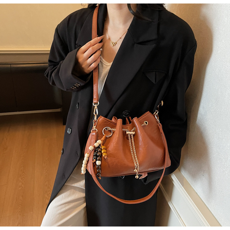 Free shipping designer bag Niche Design Drawstring Handheld Bucket Bag for Women New Autumn and Winter Fashion Commuter Shoulder Crossbody Bag