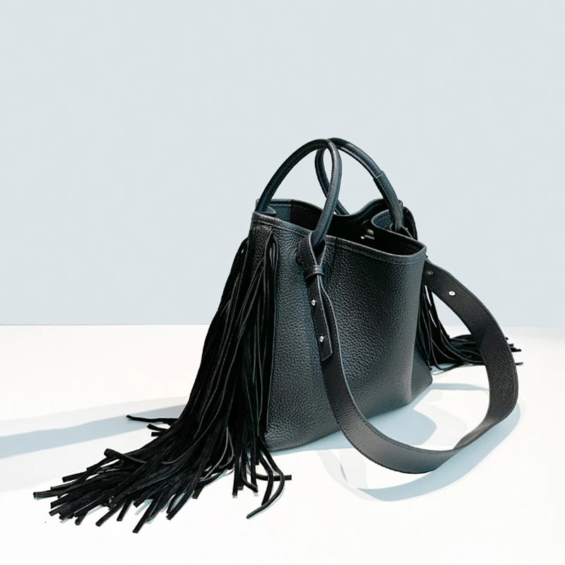First layer cowhide tassel bucket bag niche n large capacity oneshoulder crossbody womens handbag 251014