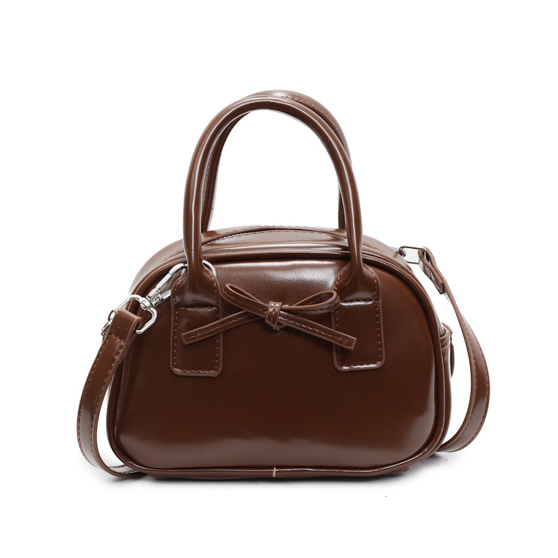 Free shipping designer bag New Niche High-End Feel Bag for Women Fashion Handheld Shell Bag Bow Pillow Bag Single Shoulder Crossbody Bag