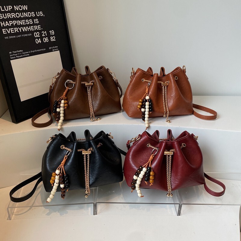 Free shipping designer bag Niche Design Drawstring Handheld Bucket Bag for Women New Autumn and Winter Fashion Commuter Shoulder Crossbody Bag