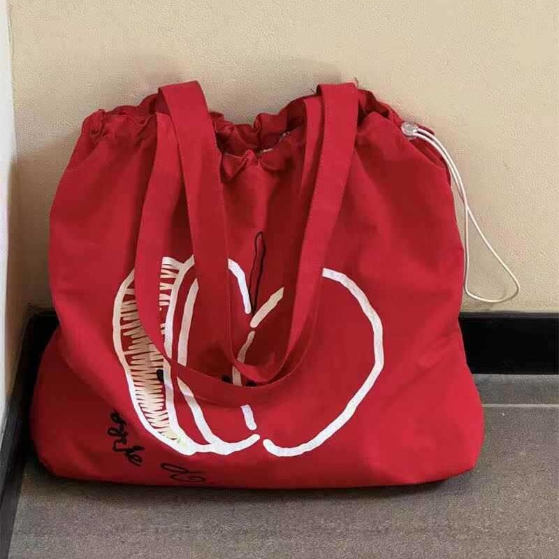 Designer's new Christmas drawstring canvas bag, fashionable commuting multifunctional shoulder bag, niche large capacity handbag