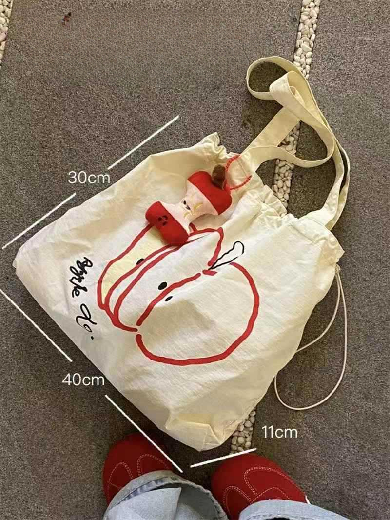 Designer's new Christmas drawstring canvas bag, fashionable commuting multifunctional shoulder bag, niche large capacity handbag