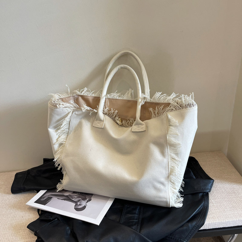 Free shipping designer bag Tassel Letter Canvas Bag Large Capacity Bag Women New Solid Color Commuting Shoulder Tote Bag