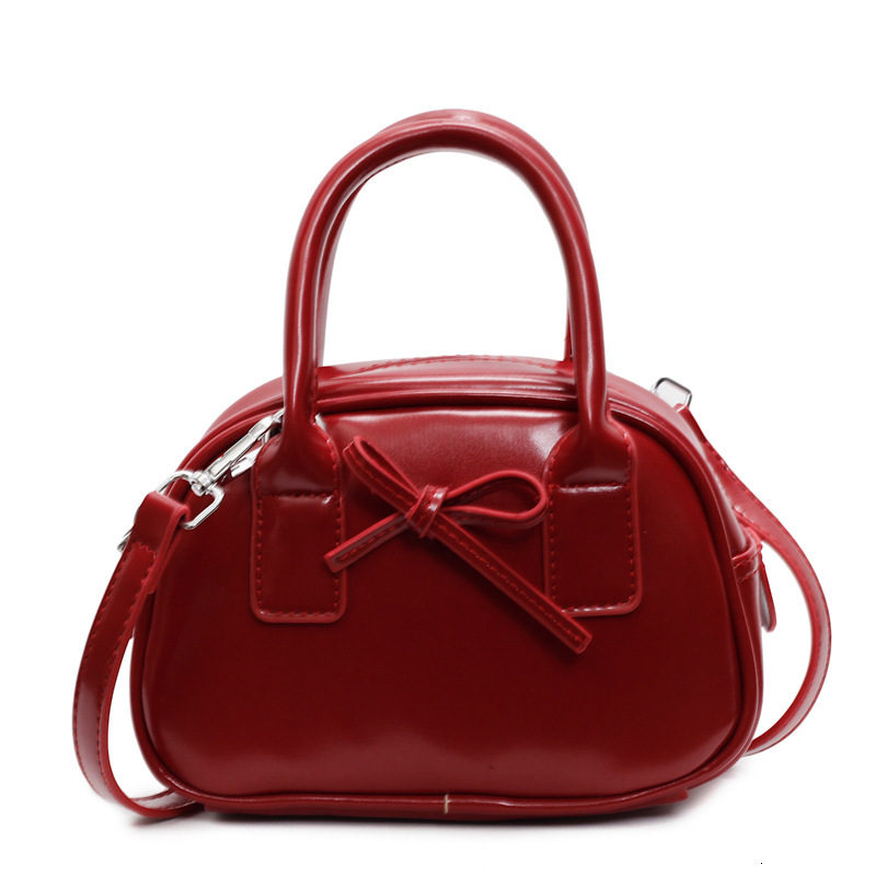 Free shipping designer bag New Niche High-End Feel Bag for Women Fashion Handheld Shell Bag Bow Pillow Bag Single Shoulder Crossbody Bag