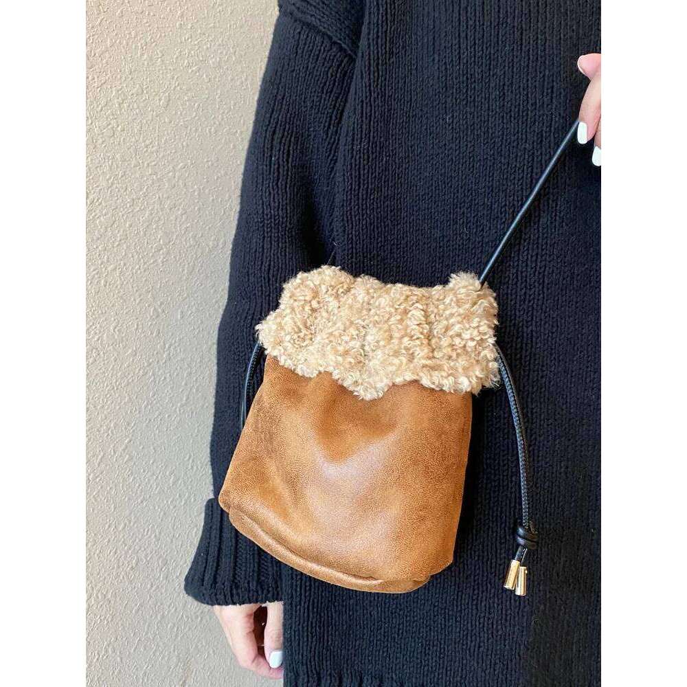 Designer Luxury Autumn And Winter Retro Drawstring Style Bucket Shaped Plush With Suede Roll Design Mini Crossbody Bag For Women