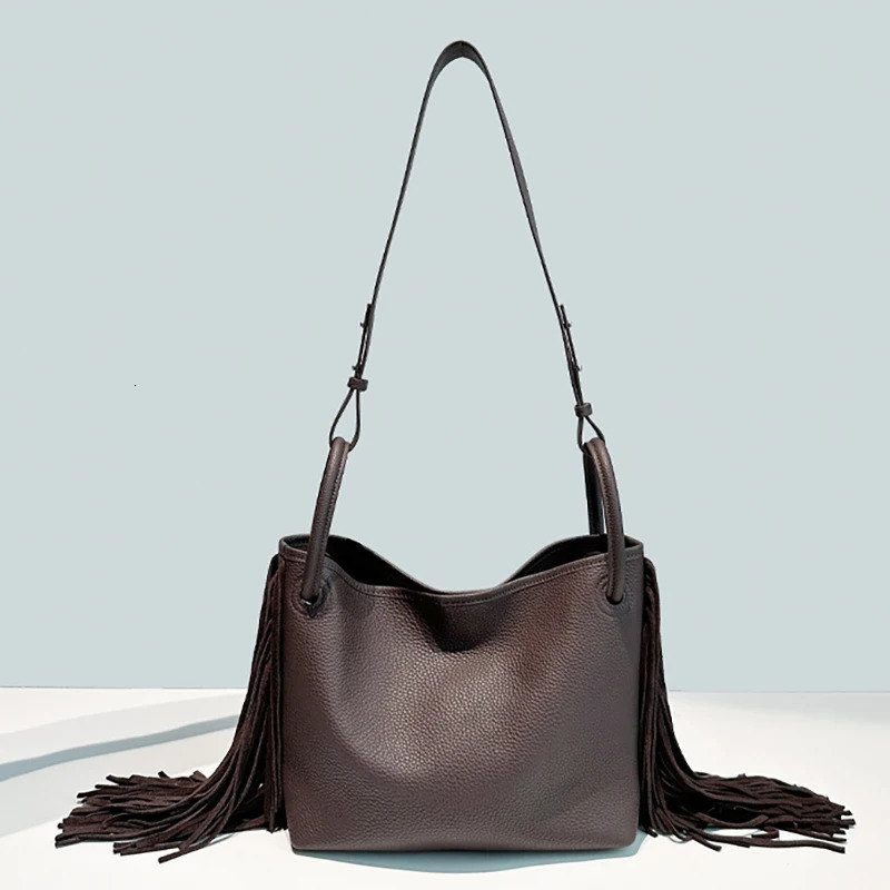 First layer cowhide tassel bucket bag niche n large capacity oneshoulder crossbody womens handbag 251014