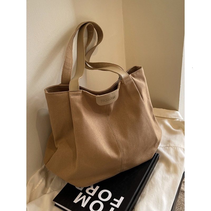 Designer ladies' large capacity canvas bag, fashionable new style, casual single shoulder tote bag, student class commuting tote bag