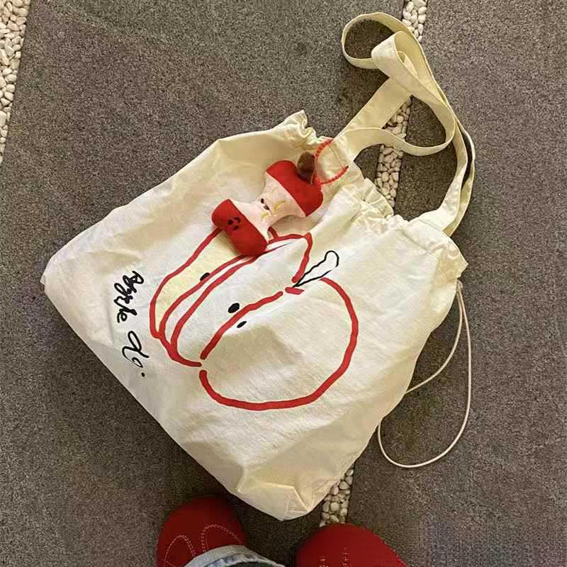 Designer's new Christmas drawstring canvas bag, fashionable commuting multifunctional shoulder bag, niche large capacity handbag