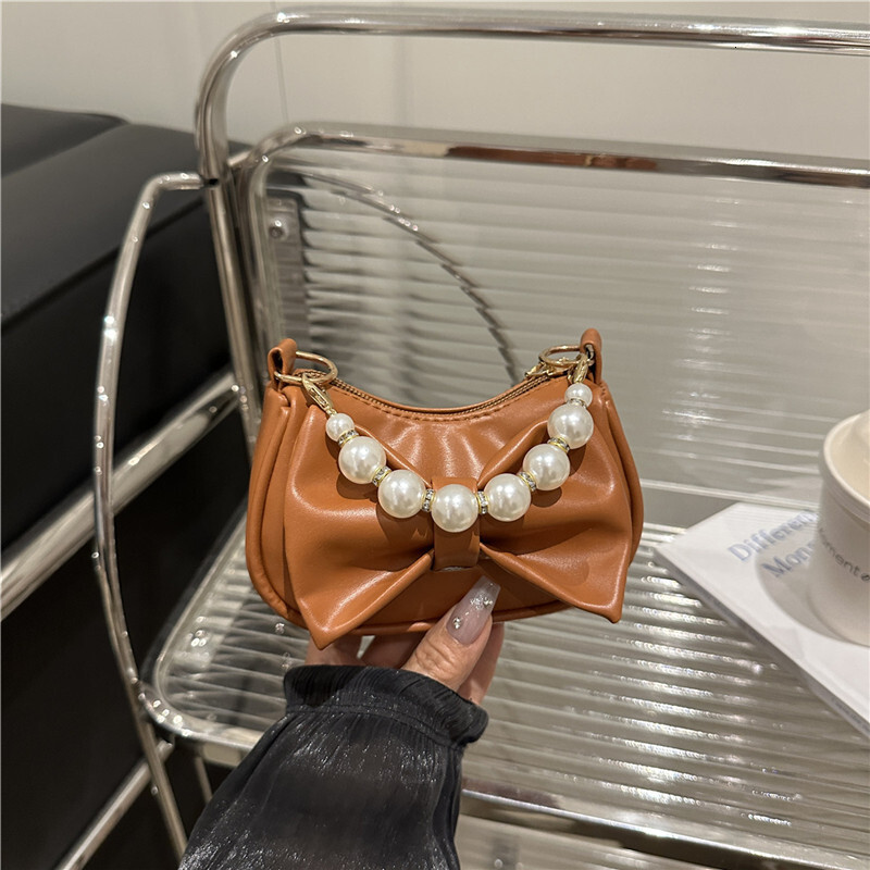 Sweet bow design handbag, winter new pearl chain design, fashionable and elegant women's shoulder bag, trendy and luxurious designer bag