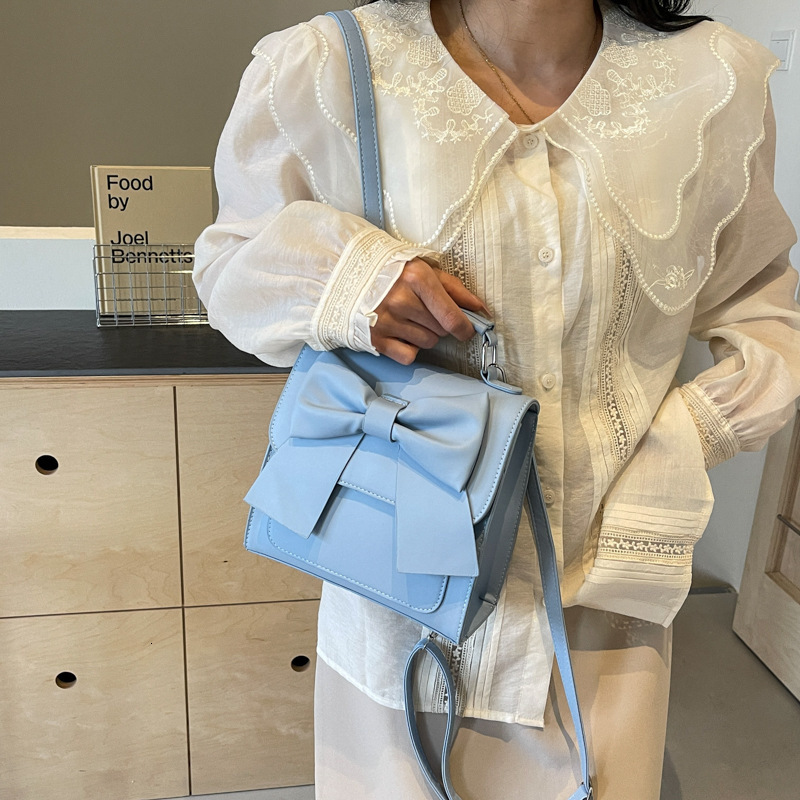 Free shipping designer bag Backpack Women New Texture Niche Design Handheld Bow School Bag Lightweight Travel Backpack