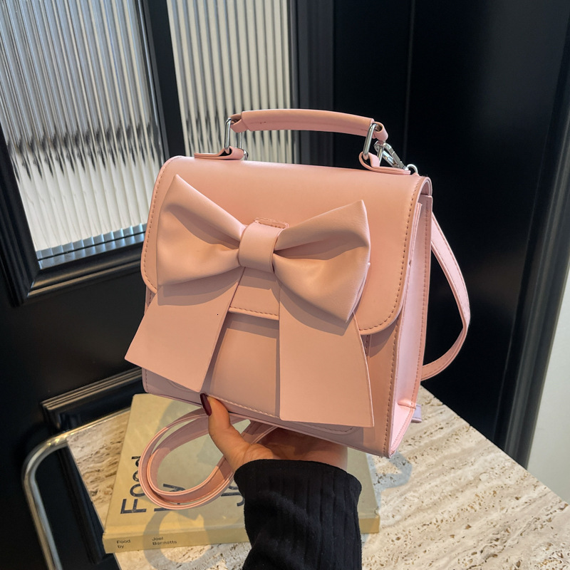 Free shipping designer bag Backpack Women New Texture Niche Design Handheld Bow School Bag Lightweight Travel Backpack