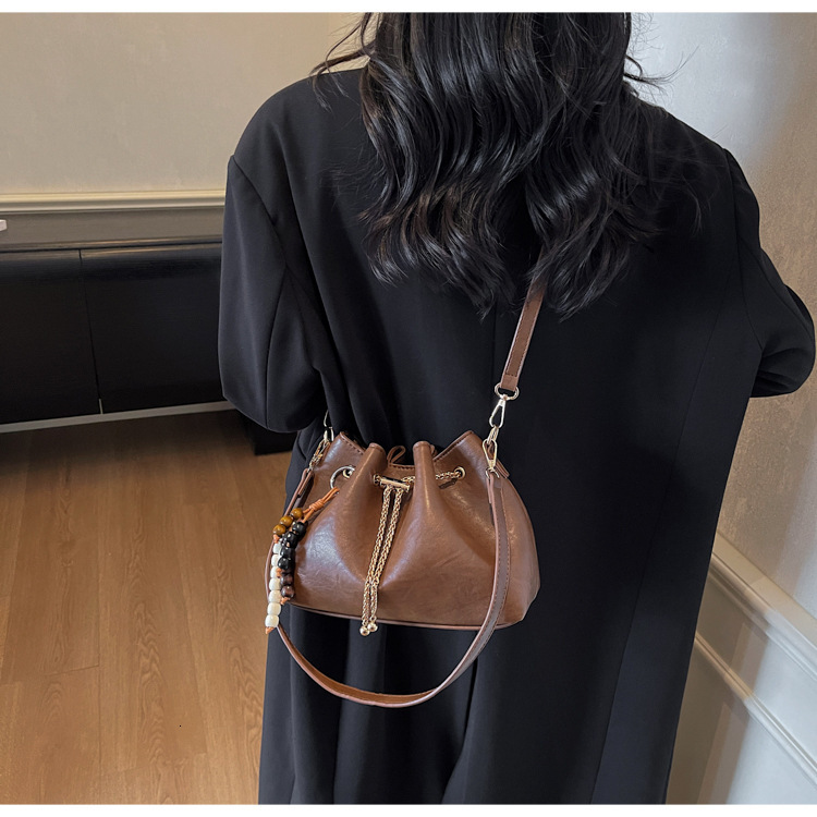 Free shipping designer bag Niche Design Drawstring Handheld Bucket Bag for Women New Autumn and Winter Fashion Commuter Shoulder Crossbody Bag