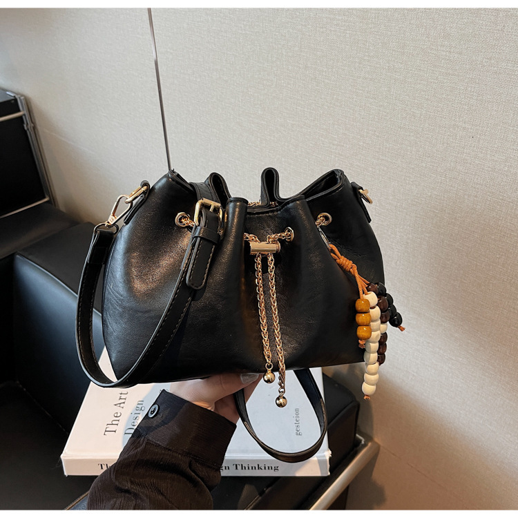 Free shipping designer bag Niche Design Drawstring Handheld Bucket Bag for Women New Autumn and Winter Fashion Commuter Shoulder Crossbody Bag