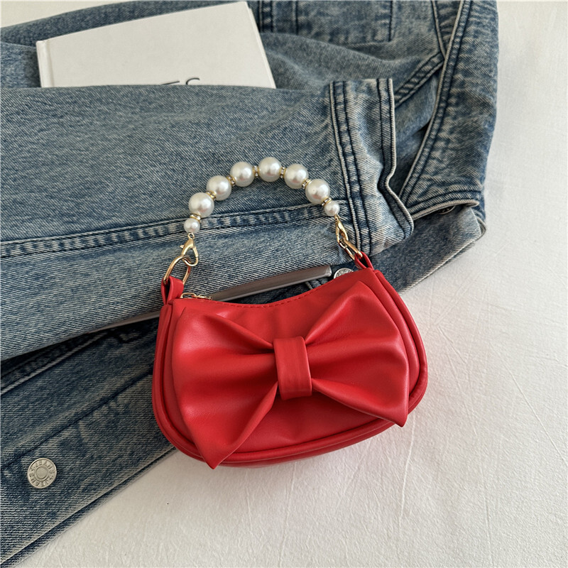 Sweet bow design handbag, winter new pearl chain design, fashionable and elegant women's shoulder bag, trendy and luxurious designer bag