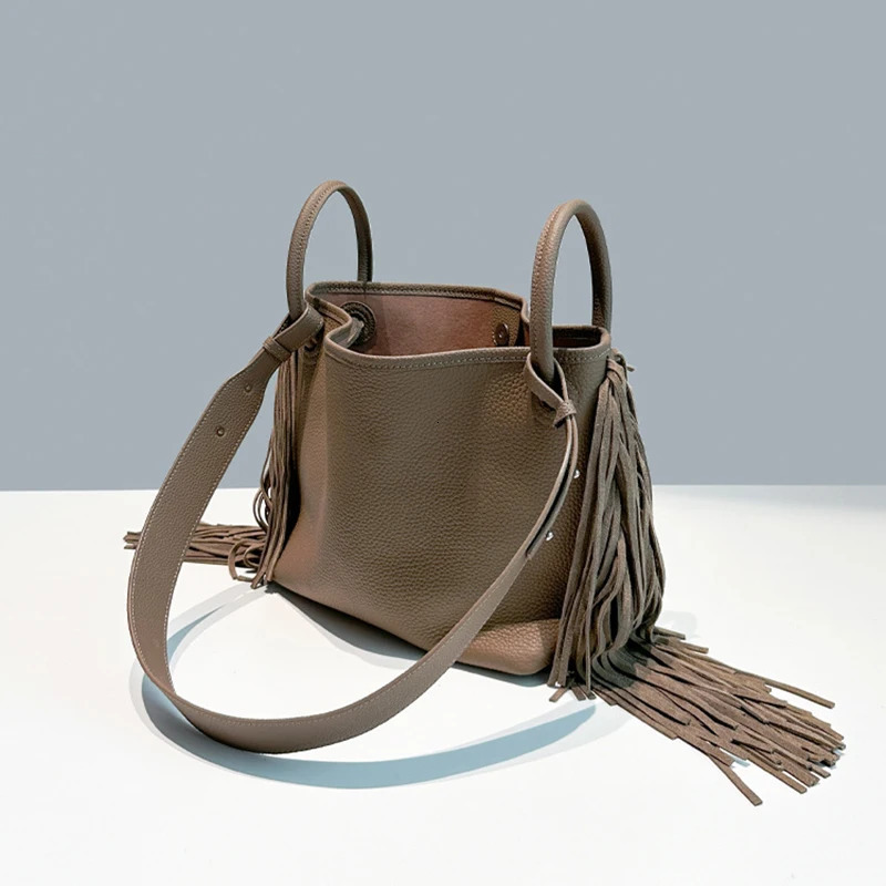 First layer cowhide tassel bucket bag niche n large capacity oneshoulder crossbody womens handbag 251014