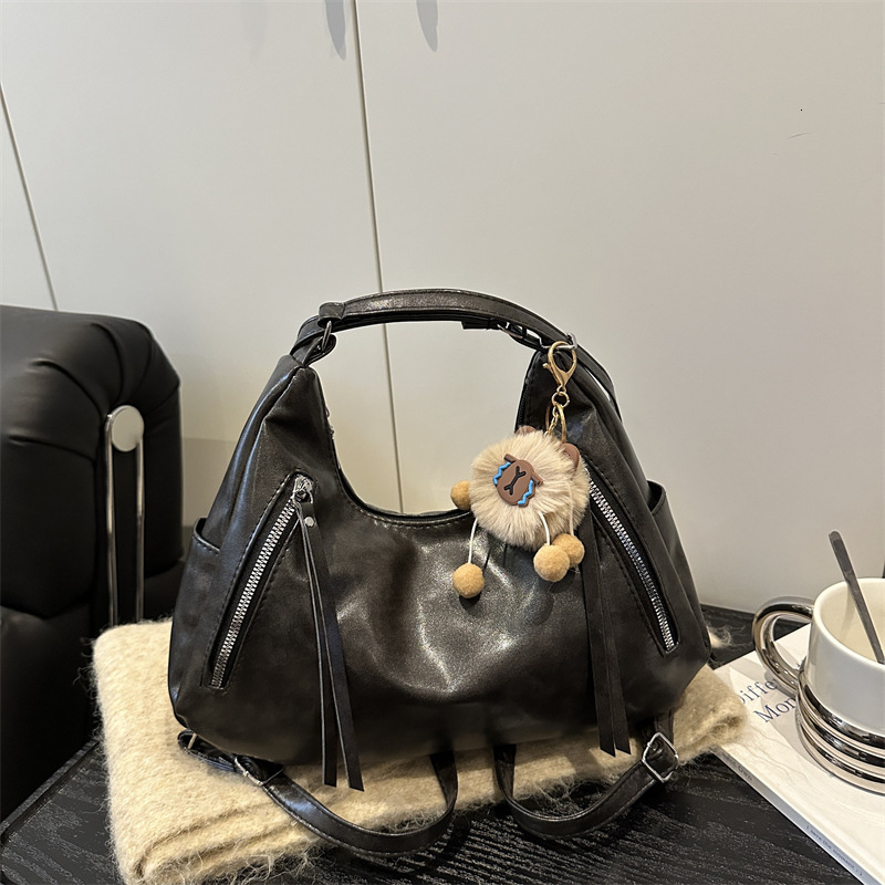 Winter new retro fashion women's handbag with simple Korean style niche design, luxurious texture, armpit bag, elegant designer bag