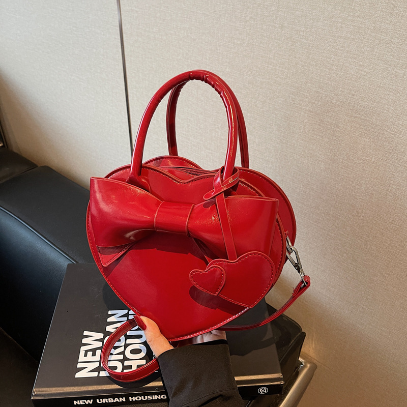 Free shipping designer bag High-end Bowknot Spring Summer New Cute Heart Bag Handheld Versatile Shoulder Crossbody Bag
