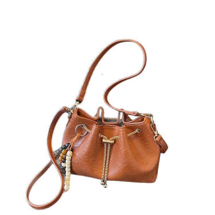 Free shipping designer bag Niche Design Drawstring Handheld Bucket Bag for Women New Autumn and Winter Fashion Commuter Shoulder Crossbody Bag