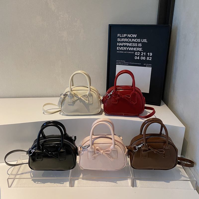 Free shipping designer bag New Niche High-End Feel Bag for Women Fashion Handheld Shell Bag Bow Pillow Bag Single Shoulder Crossbody Bag