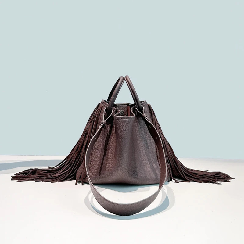 First layer cowhide tassel bucket bag niche n large capacity oneshoulder crossbody womens handbag 251014