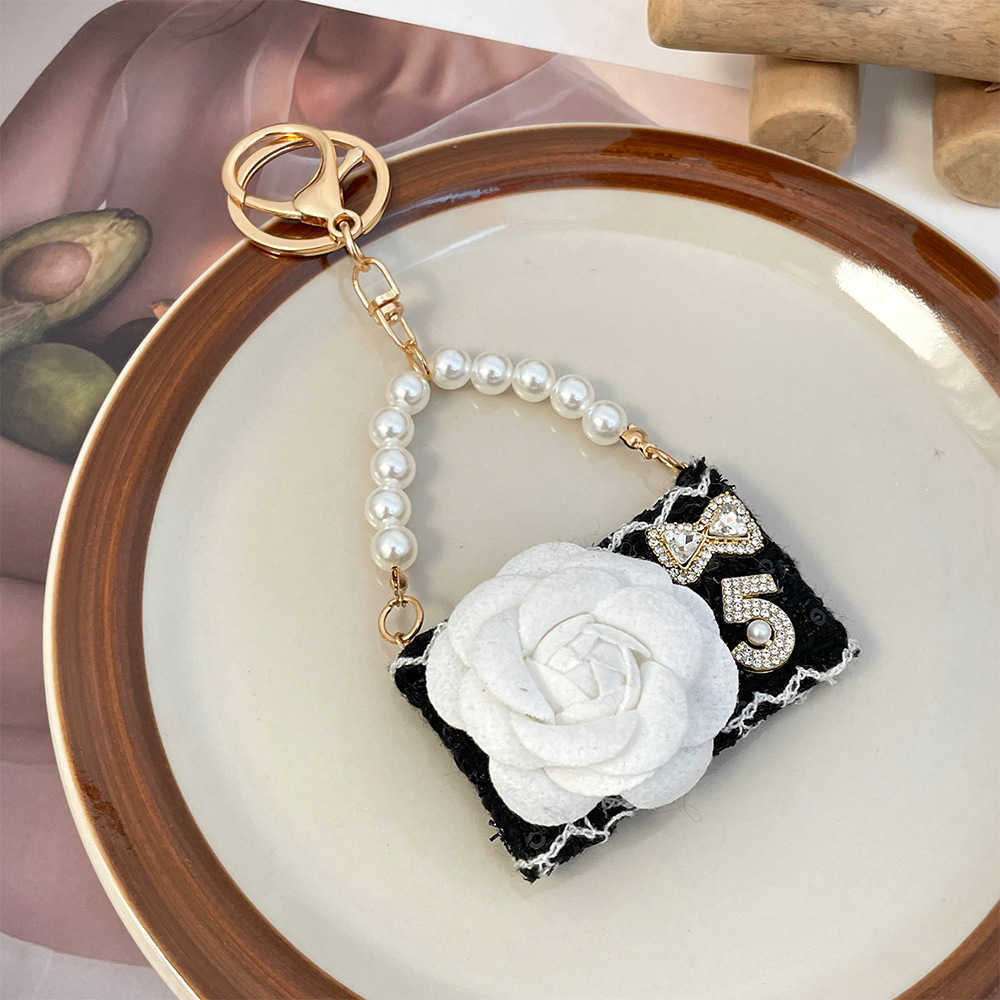 New fashionable camellia handbag model keychain autumnwinter bag decoration keychain small gift J251118