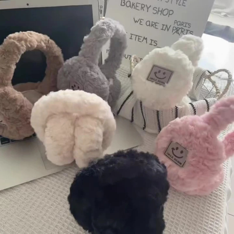 Winter Out Womens Soft Cold Wind Cartoon Smiley Face Warm Ear Muffs Milan Mink Velvet Girls Versatile Plush Ear Muffs Foldable 251027