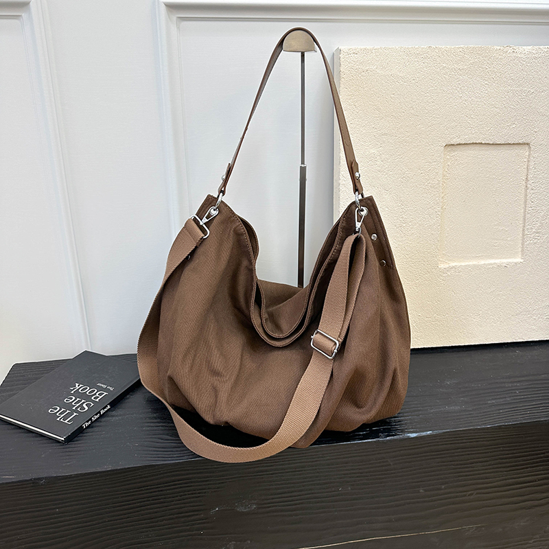 Autumn women's simple and fashionable large capacity synthetic leather handbag, new fashionable college student daily commuting lightweight shoul