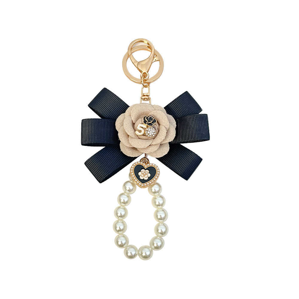 Highend Exquisite Korean Fashion Creative Camellia Ribbon Pearl Keychain Womens Bag Pendant Small Gift J251118