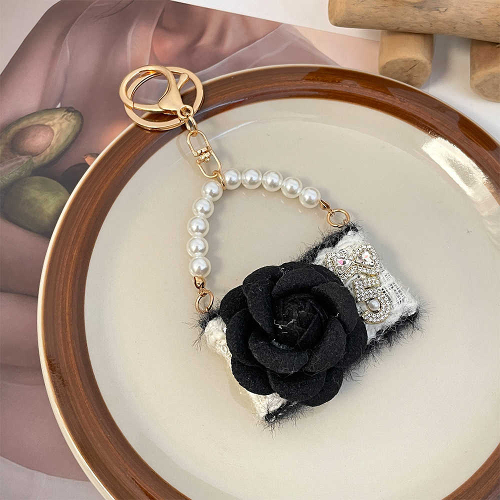 New fashionable camellia handbag model keychain autumnwinter bag decoration keychain small gift J251118