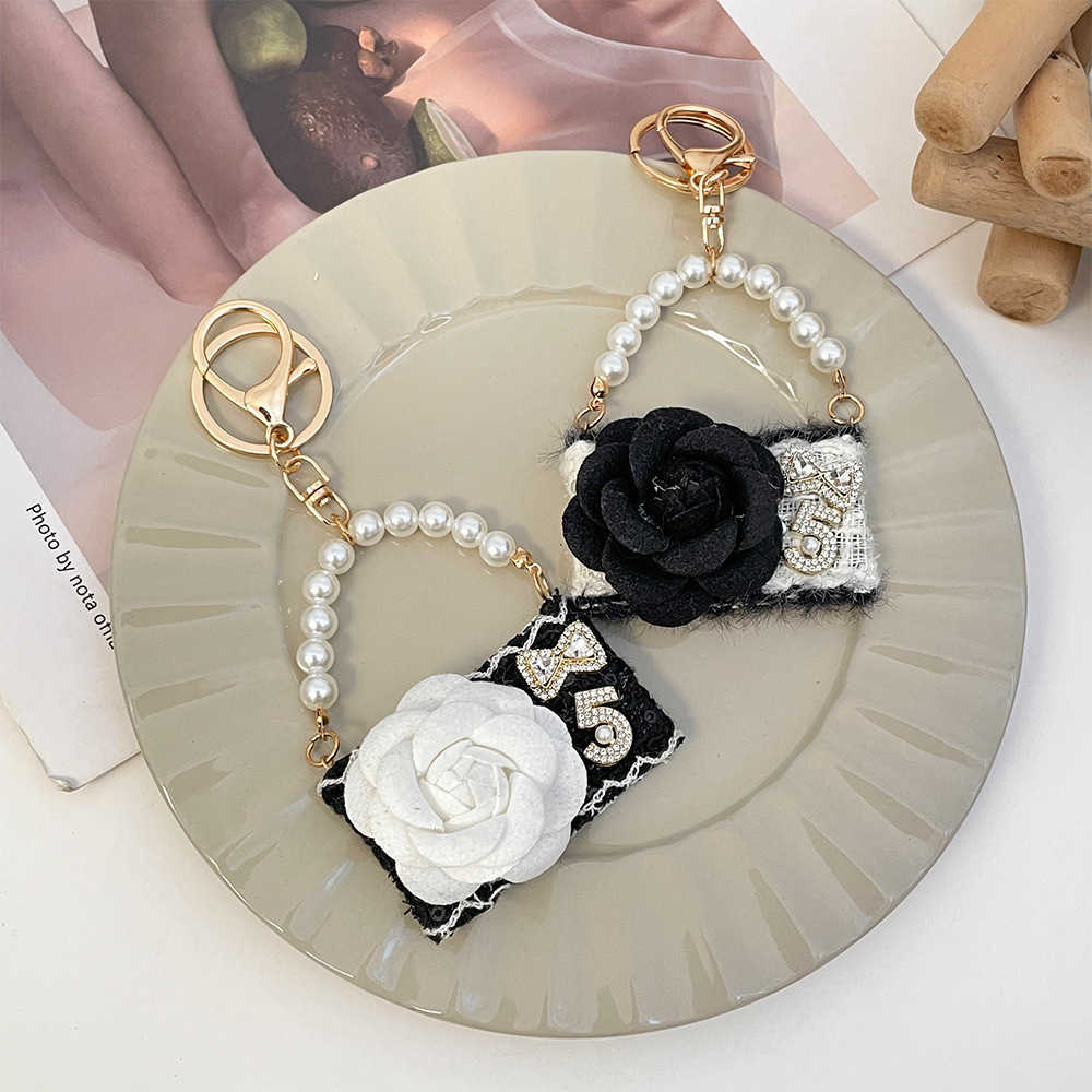 New fashionable camellia handbag model keychain autumnwinter bag decoration keychain small gift J251118