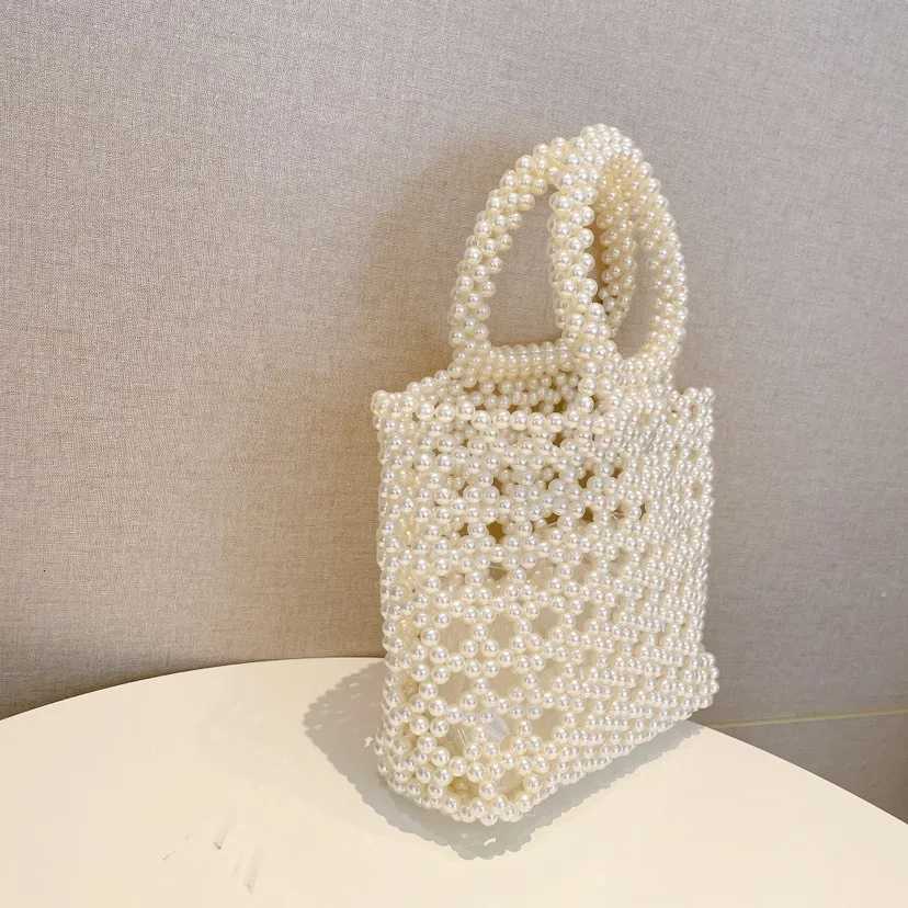 Fashion New Hollow Handmade Beaded Bag with Handheld pearl Bag for Wedding Party High quality Glittering Evening Bags Clutch bag H251027