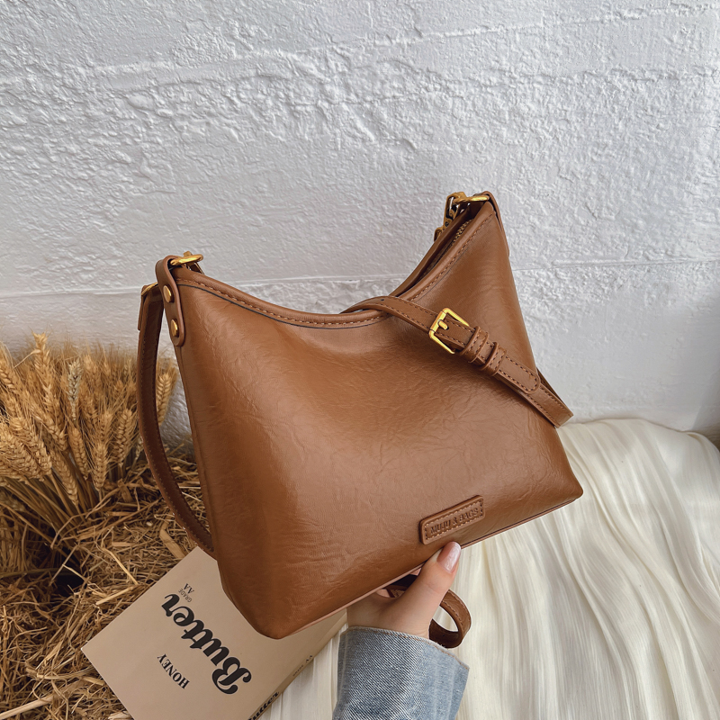 Summer women's simple and fashionable large capacity synthetic leather handbag, new fashionable college student daily commuting lightweight cross